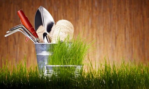 Professional gardener trimming hedges in Cricklewood